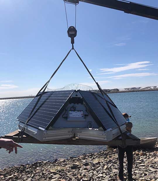 MPC-Buoy being installed in a potable water pond